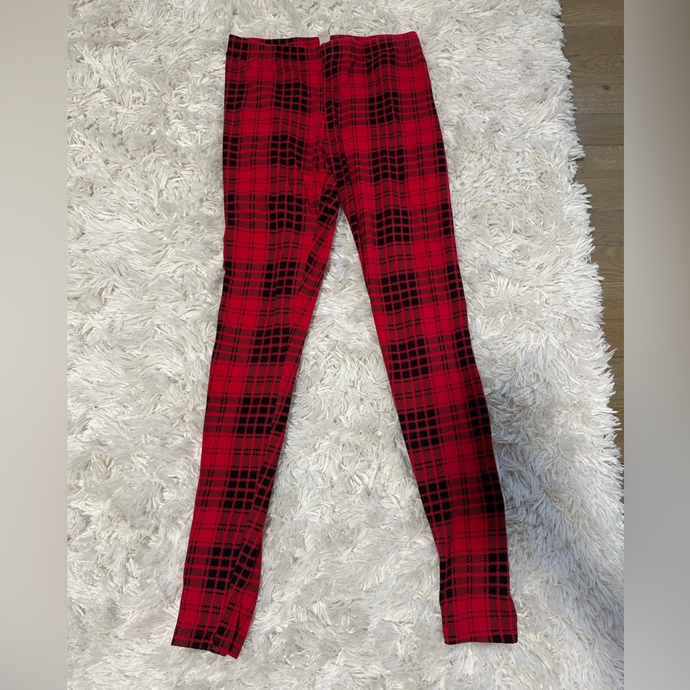 Red and black plaid leggings by Forever 21